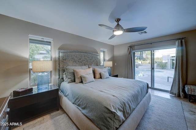 bedroom with multiple windows, access to outside, and ceiling fan