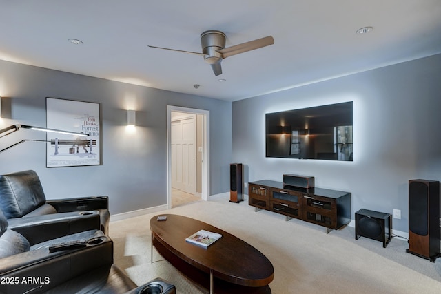 carpeted living room featuring ceiling fan