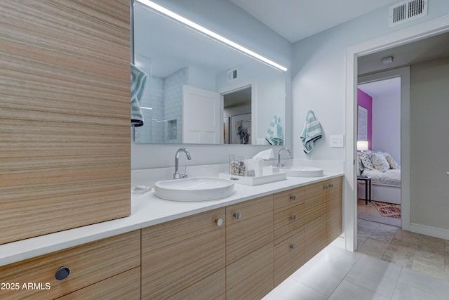 bathroom featuring vanity and tile patterned flooring