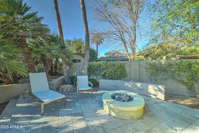 view of patio featuring an outdoor fire pit