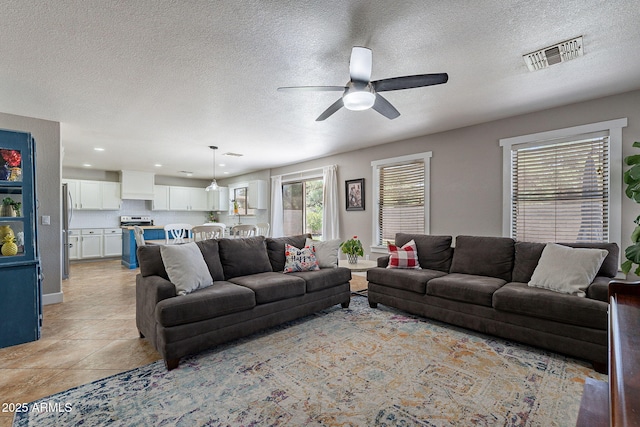 3047 S Mandy St, Mesa, AZ 85212 - living area featuring ceiling fan, a textured ceiling, recessed lighting, and light tile patterned floors