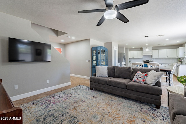 3047 S Mandy St, Mesa, AZ 85212 - living room featuring a ceiling fan, a textured ceiling, and recessed lighting