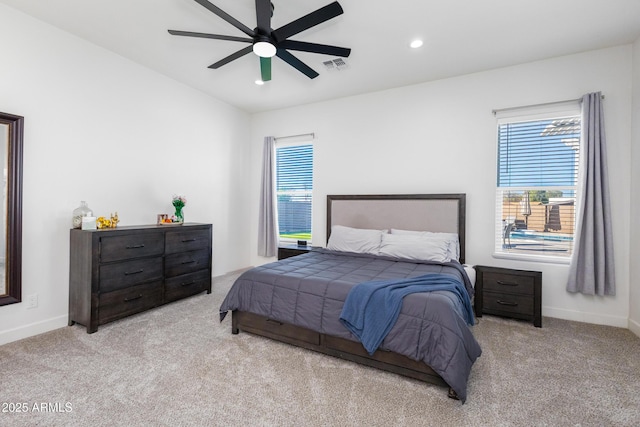 bedroom featuring recessed lighting, light carpet, visible vents, and baseboards