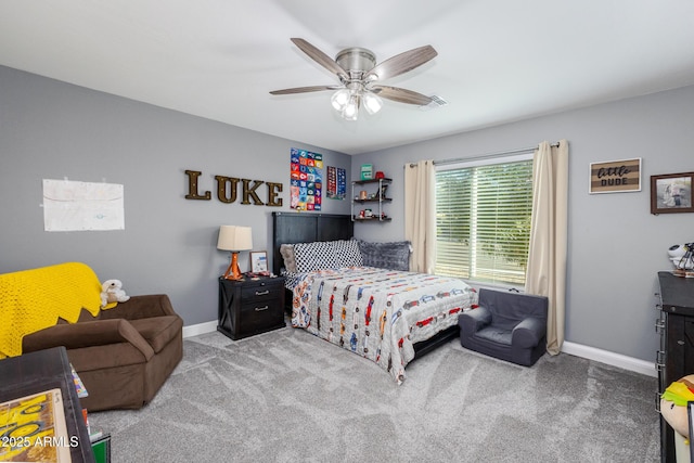 bedroom with light carpet, ceiling fan, visible vents, and baseboards