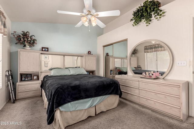 bedroom with light carpet and ceiling fan