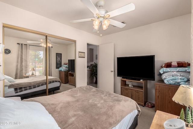 bedroom featuring carpet floors, a closet, and a ceiling fan