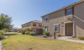 rear view of house with a yard