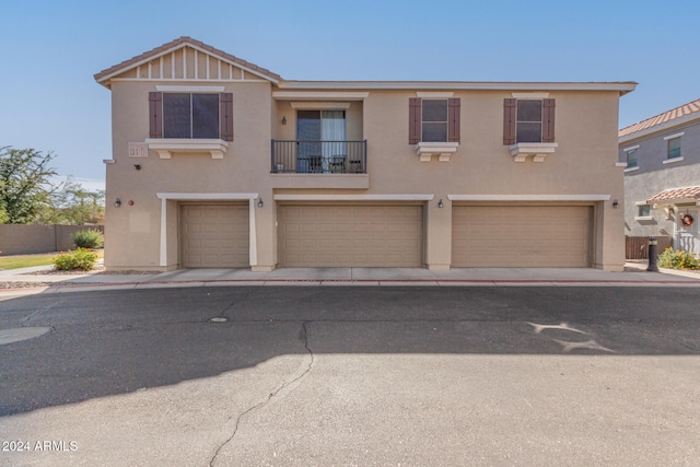 townhome / multi-family property featuring a garage