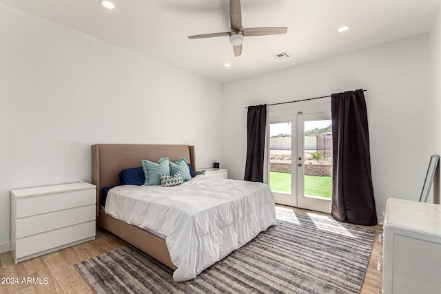 bedroom with light hardwood / wood-style flooring, access to outside, french doors, and ceiling fan