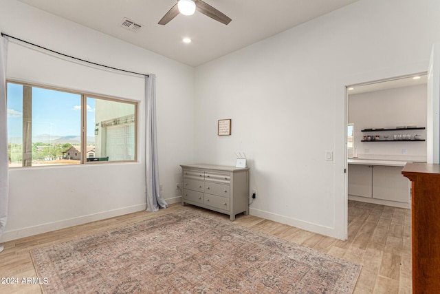 bedroom featuring light hardwood / wood-style floors and ceiling fan