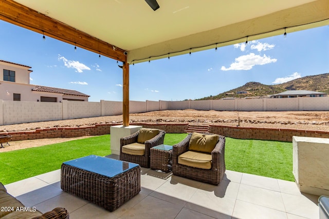 view of patio / terrace with a mountain view