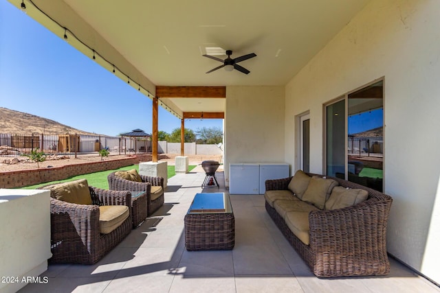 view of patio featuring a gazebo, ceiling fan, and an outdoor hangout area