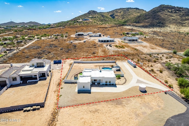 birds eye view of property with a mountain view