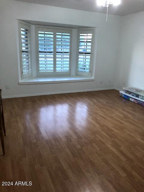 empty room featuring dark hardwood / wood-style floors