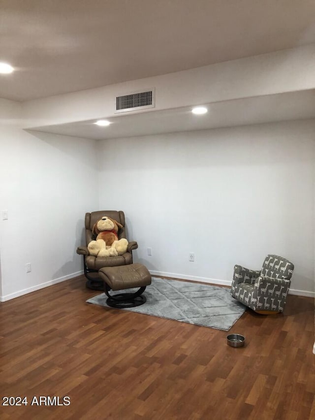 unfurnished room with dark wood-type flooring