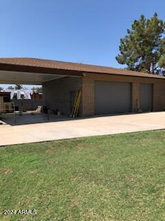 garage with a lawn