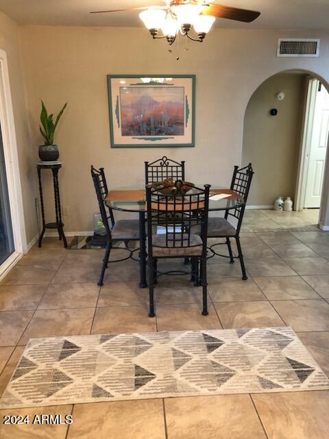 dining room featuring tile patterned flooring and ceiling fan