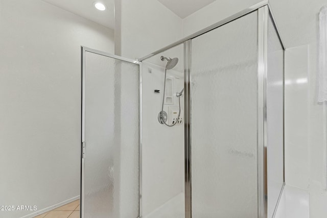 bathroom with a stall shower, recessed lighting, and tile patterned floors