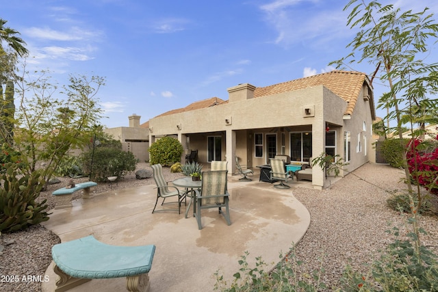 rear view of house featuring a patio