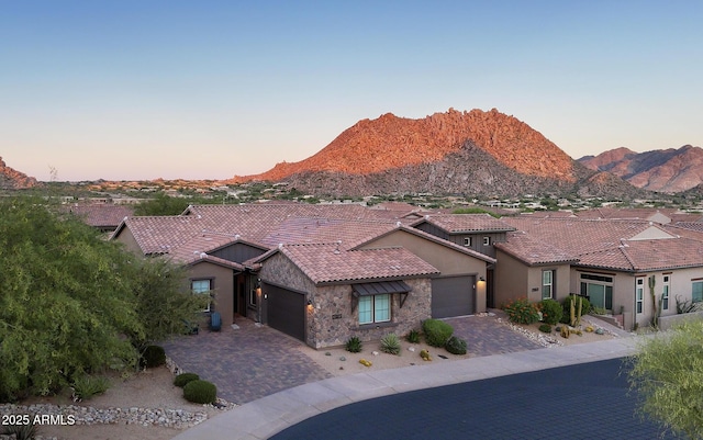 26885 N 104th Pl, Scottsdale, AZ 85262 - view of front facade with stucco siding, an attached garage, a tile roof, decorative driveway, and a mountain view