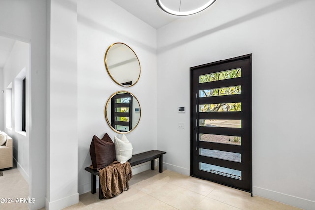 entryway featuring light tile patterned floors