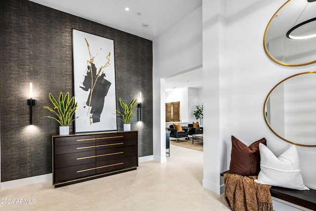 hall featuring light tile patterned flooring