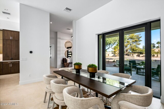 tiled dining area with french doors