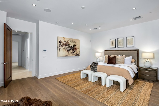 bedroom featuring dark hardwood / wood-style flooring