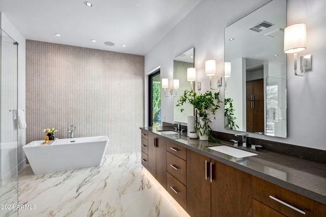 bathroom with vanity and independent shower and bath