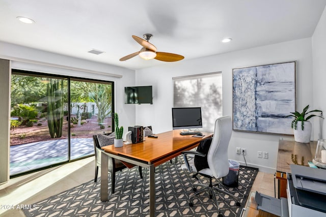 tiled office space featuring ceiling fan and plenty of natural light