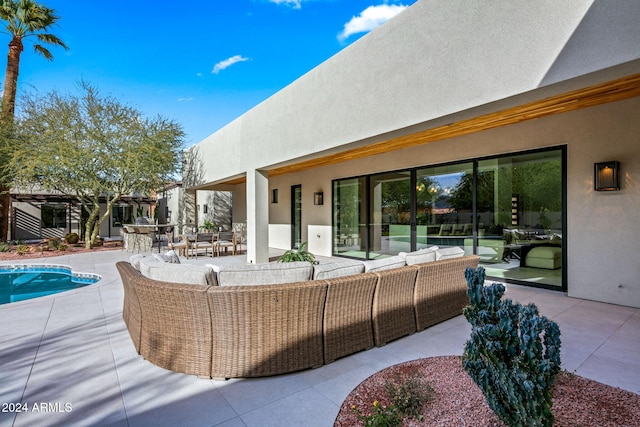 view of patio featuring an outdoor living space and a fenced in pool