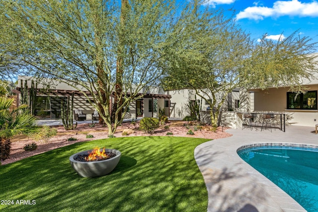 view of pool with a patio area and a bar