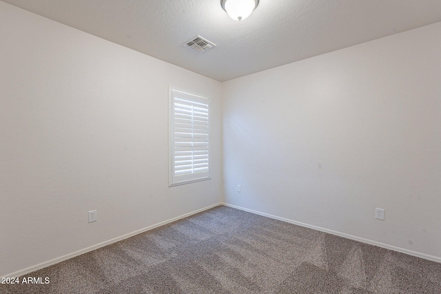 empty room featuring carpet floors