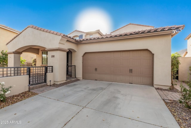 mediterranean / spanish house featuring a garage