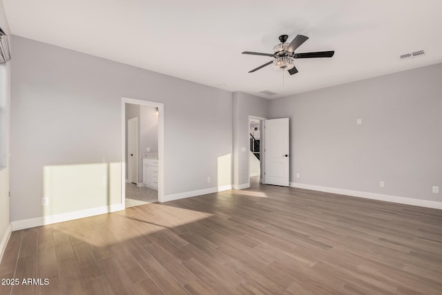 unfurnished room featuring ceiling fan and wood-type flooring