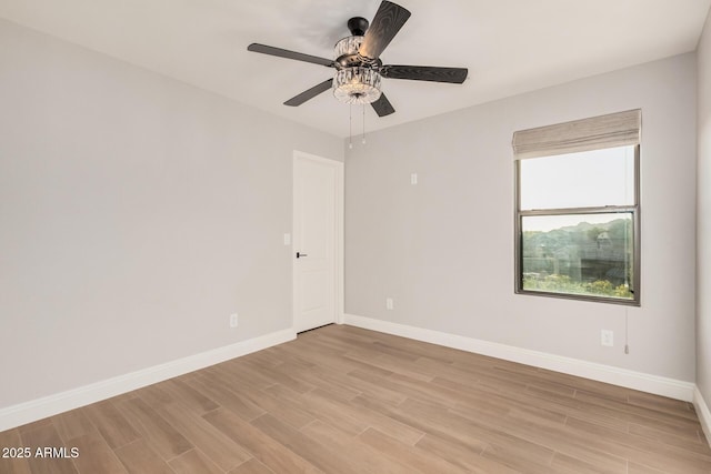 unfurnished room featuring ceiling fan and light hardwood / wood-style flooring