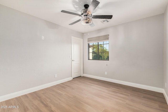 empty room featuring ceiling fan and light hardwood / wood-style flooring