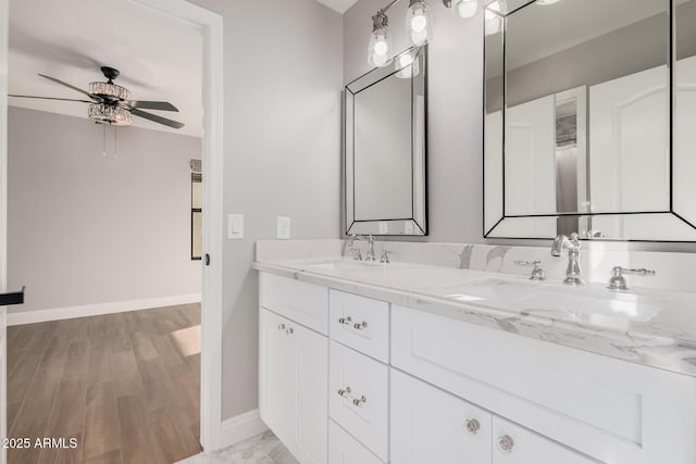 bathroom featuring vanity, hardwood / wood-style flooring, and ceiling fan