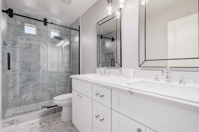 bathroom with tile patterned flooring, vanity, toilet, and a shower with shower door