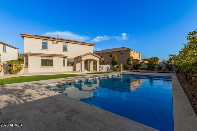 view of swimming pool featuring a patio area