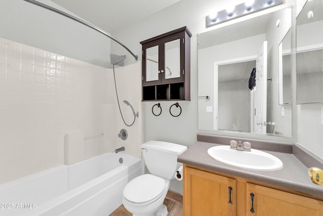 full bathroom with vanity, tub / shower combination, and toilet