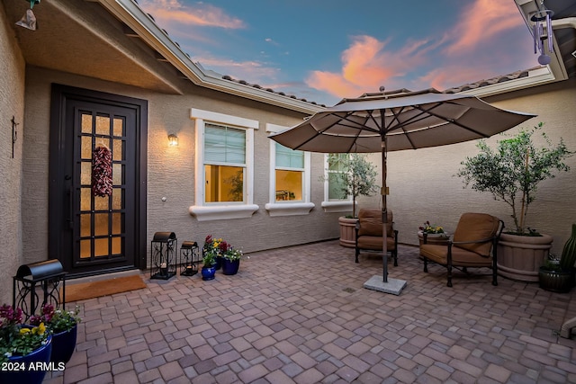 view of patio terrace at dusk