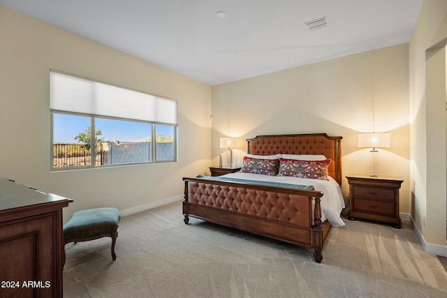 bedroom with light colored carpet