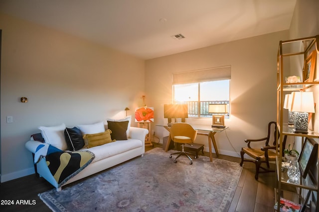 sitting room with hardwood / wood-style flooring