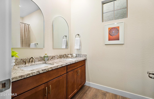 bathroom featuring vanity and wood-type flooring