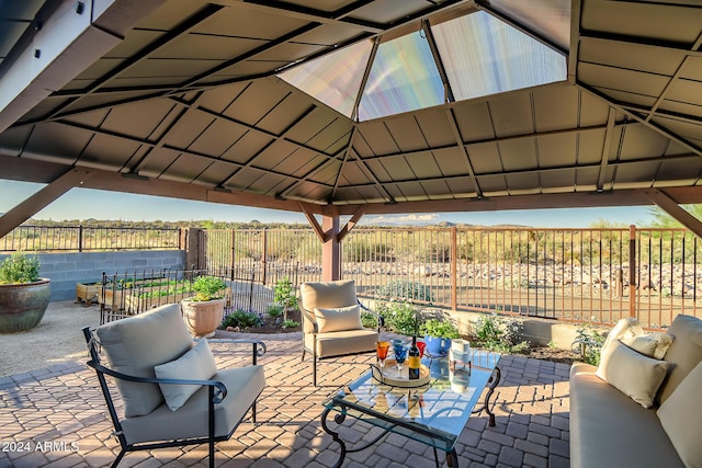 view of patio with a gazebo and a rural view