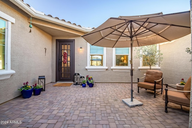 property entrance featuring a patio