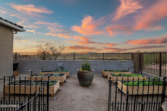 view of patio terrace at dusk