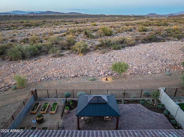 exterior space with a gazebo and a mountain view