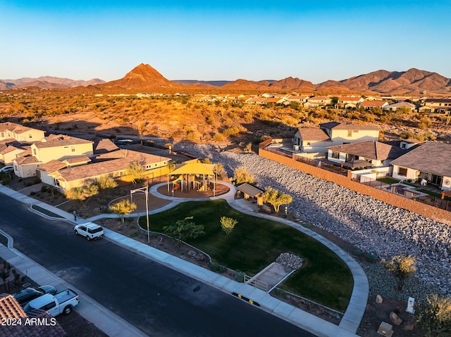 birds eye view of property with a mountain view